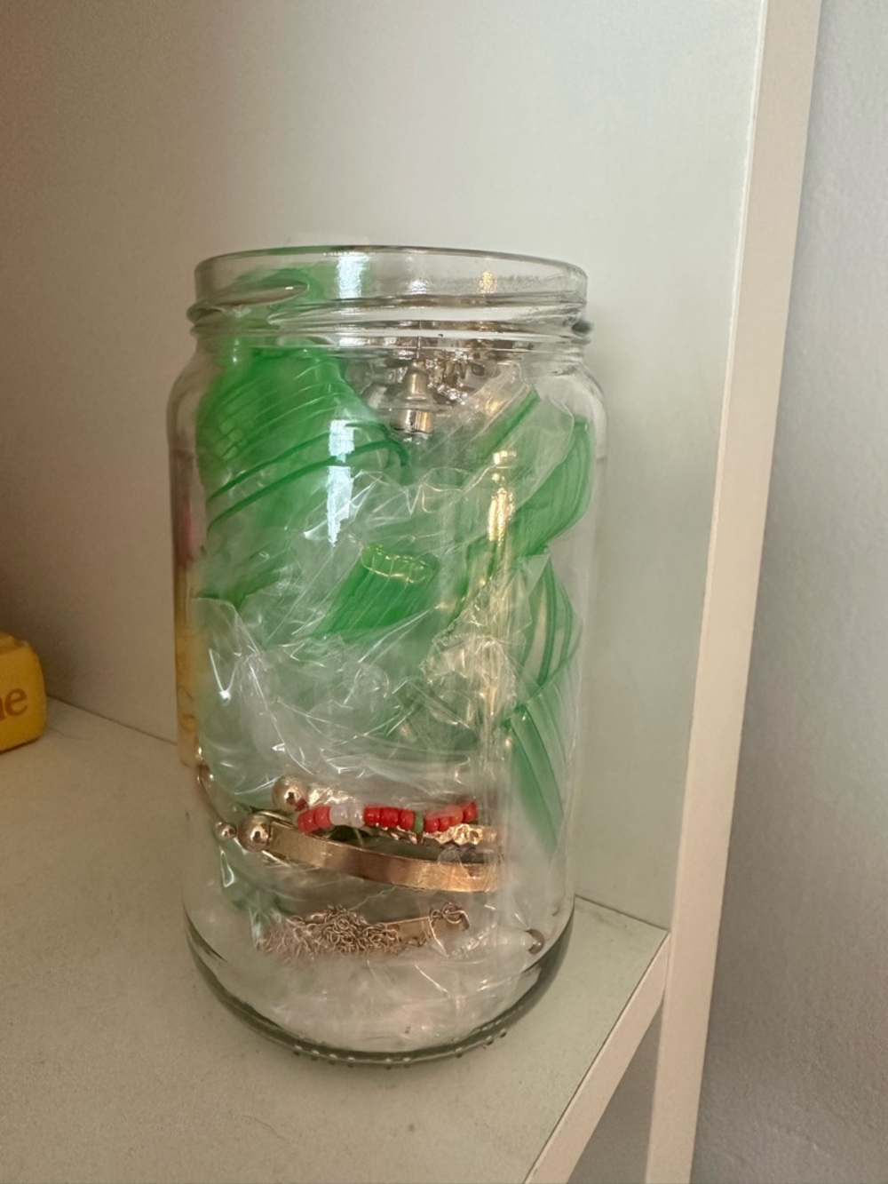 Clear Glass Jar Filled withJewelry